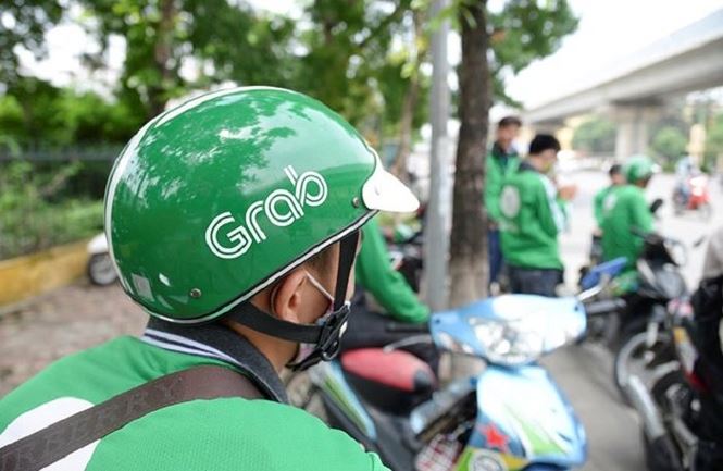 Grab tăng giá cước sau khi thâu tóm Uber