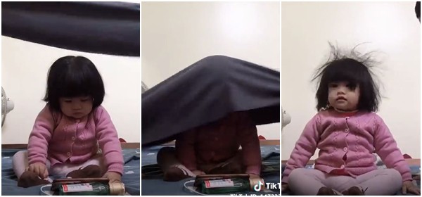 Bị bố mẹ đem ra làm trò giải trí, biểu cảm ngơ ngác của bé gái dễ thương khiến dân mạng cười nghiêng ngả