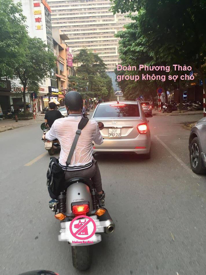 Nhìn người đàn ông đi xe máy với lưng áo ướt đẫm mới thấy thời tiết Hà Nội nóng đến thế nào!