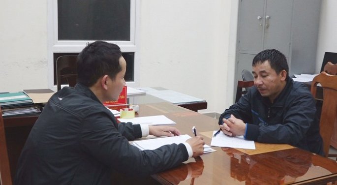 Đinh Thành Nho tại cơ quan công an.