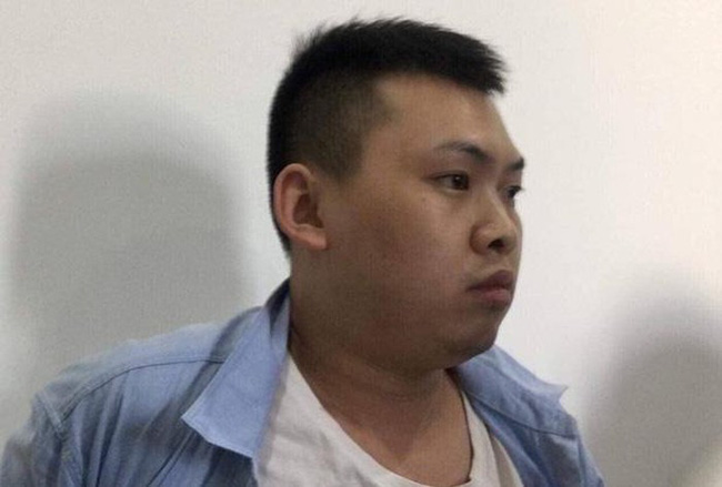Chân dung nghi phạm Xiao Guiping tại cơ quan công an.