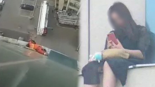 Tiểu Dịch ngồi trên ban công tầng 8 của 1 tòa nhà bách hóa.