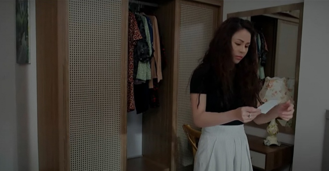 An Nhiên phát hiện ảnh Kitty trong tủ của bà Xinh.