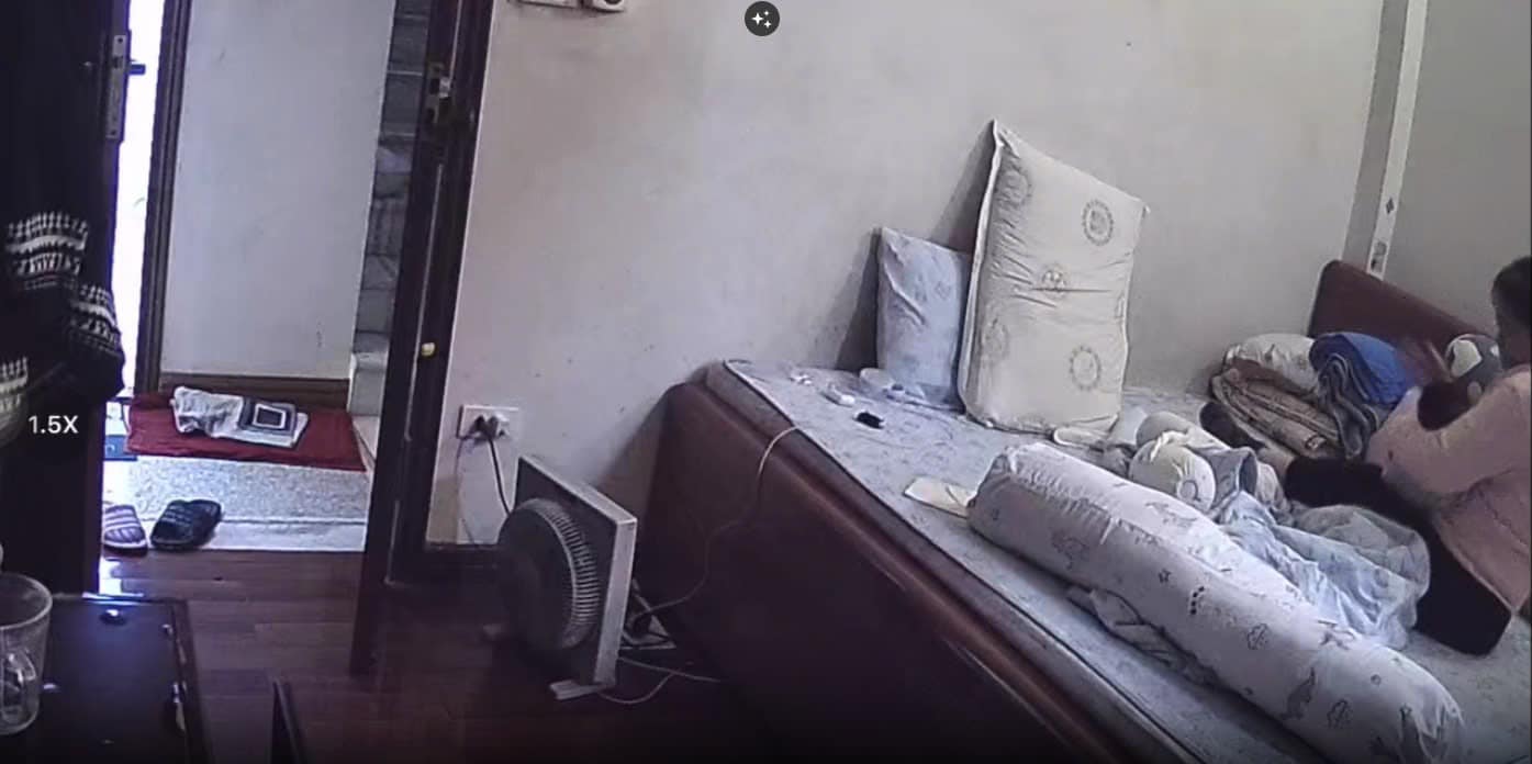 Hình ảnh cắt từ clip ghi lại người giúp việc đang có hành vi bạo hành với cháu bé