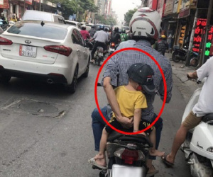 Ông bố đèo con đi viện và hành động của người đi đường khiến tất cả xúc động hơn
