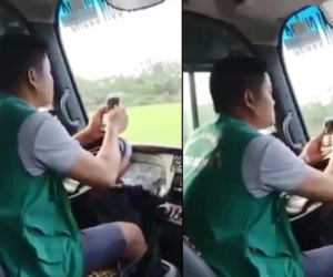 Công an triệu tập tài xế xe buýt vừa lái xe bằng khuỷu tay vừa lướt điện thoại