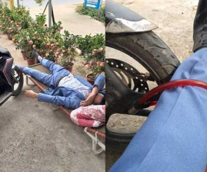 Dở khóc dở cười với hình ảnh người đàn ông ăn mặc bảnh bao ngủ vạ giữa đường, say khướt vẫn không quên bảo vệ xe máy