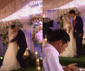 Chú rể có hành động gây sốc khi hôn cô dâu ngay trên sân khấu hôn lễ khiến nhiều người bàng hoàng chẳng hiểu lí do là sao