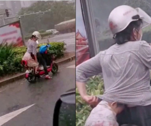 Đón con về giữa trời mưa, việc làm của người mẹ khiến ai cũng cảm động