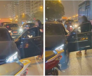 Người phụ nữ chặn xe Mercedes giữa đường phố Hà Nội nghi do bị 'bạn tốt cướp chồng', cú đá của cô gái trẻ từ ô tô gây chú ý