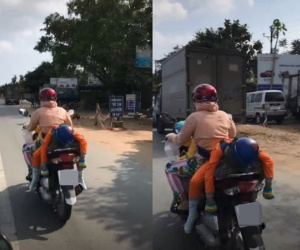 Nhìn từ phía sau thấy cậu bé ngủ trên yên xe máy đang chạy với tư thế lạ, vòng ra đằng trước thì cảnh tượng càng gây ngỡ ngàng hơn