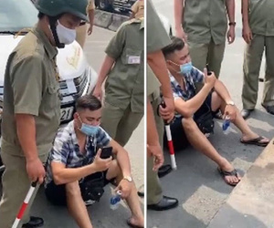 Lái ô tô vi phạm, Youtuber Lê Chí Thành ngồi trước đầu xe yêu cầu công an làm đúng: 'Đưa hợp đồng cẩu xe ra đây'