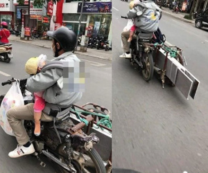 Thót tim với cảnh người đàn ông chở đồ cồng kềnh trên phố mà lái xe một tay, nhìn đứa trẻ anh bế trong nhưng mà xót xa