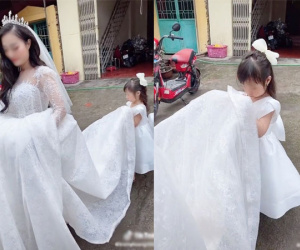 Nhói lòng trước hình ảnh con gái nhỏ buồn thiu, nâng váy tiễn mẹ đi lấy chồng