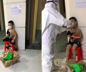 Bé trai 6 tuổi một mình đi nhận kết quả dương tính Covid-19: Ánh mắt ngơ ngác, ngồi nép vào cánh cửa
