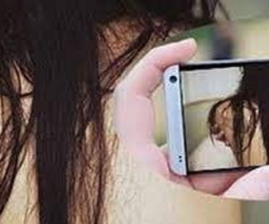 Bắt gã trai dùng chính clip 'nóng' người tình U50 gửi để tống tiền