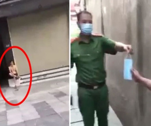 Chăm chỉ đi đổ rác giúp vợ ngày Hà Nội giãn cách, người đàn ông bị công an đưa về phường