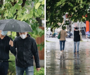 Ảnh: Người Hà Nội co ro trong cơn mưa tầm tã kết hợp không khí lạnh tăng cường
