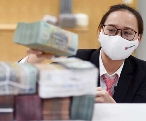 Ngân hàng đã 'hi sinh' bao nhiêu tiền lãi cho khách hàng bị ảnh hưởng bởi Covid-19?