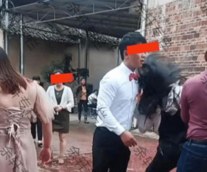 Cô gái say rượu lao vào ôm chặt chú rể giữa đám cưới, cô dâu đáp trả gây tranh cãi