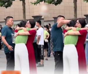 Ấm lòng hình ảnh nữ sinh đi thi đại học không làm được bài chạy ra òa khóc nức nở được mẹ ôm chặt an ủi còn bố bên cạnh vỗ về
