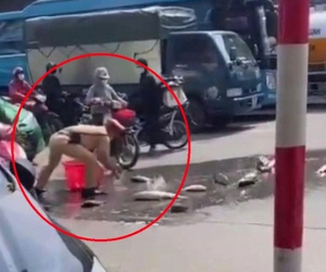 Hơn 1 tạ cá đổ ra giữa đường và hành động nhanh gọn của cảnh sát giao thông thu về 'triệu tim'