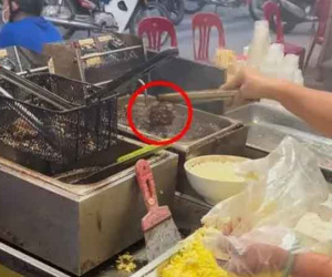 Thấy chảo dầu chiên đen sì khi mua bánh gà, thanh niên vừa hỏi 1 câu đã bị chửi 'vuốt mặt không kịp'