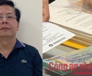 Khám xét phòng quyền Trưởng Phòng Kiểm định, lộ 2 cọc tiền nguyên seri trong chiếc cặp cũ sờn!