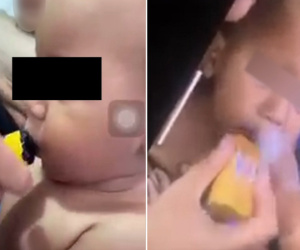 Mẹ cười thích thú khi con trai 11 tháng tuổi ho sặc sụa vì bị ép hút thuốc lá điện tử