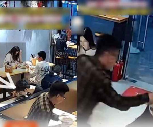 Đang ngồi yên lành trong quán ăn, người đàn ông bỗng cầm bát mỳ ụp lên đầu khách nữ rồi chạy thẳng