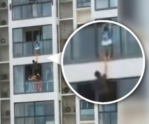 'Người nhện' Trung Quốc gây sốt vì cứu cháu bé treo lủng lẳng ở tầng 14