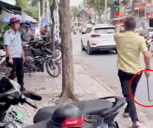 Xôn xao clip chủ tiệm tóc cầm xà beng đuổi, dọa đánh cán bộ phường
