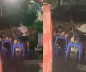Clip thanh niên che ô cho khách ngồi ăn giữa trời mưa 'gây bão' mạng