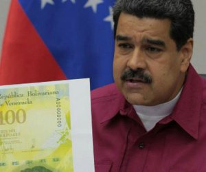 Dân Venezuela mang tiền bớt nặng hơn nhờ tờ 100.000 bolivar