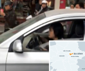 Nữ tài xế lái ôtô đẩy cảnh sát giao thông đi hơn trăm mét trên phố