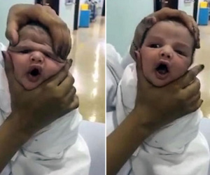 Y tá vừa cười vừa bóp mặt trẻ sơ sinh đến biến dạng