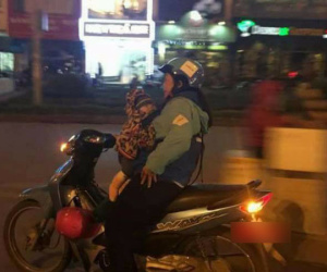 Hình ảnh xúc động trước thềm 8/3: Nữ tài xế Uber địu em bé đi làm cùng trong đêm muộn
