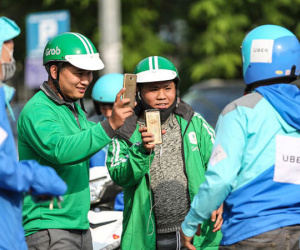 Ngành thuế yêu cầu Grab nộp thuế chuyển nhượng thay Uber