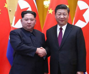 Điều ẩn chứa sau cái bắt tay lịch sử của Kim Jong-un và Tập Cận Bình