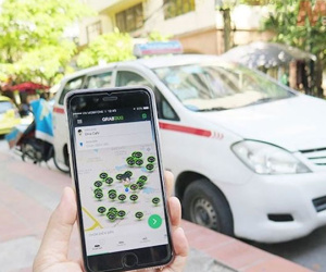 Grab tăng giá cước sau khi thâu tóm Uber
