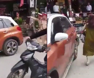 Bị nhắc đỗ xe gây cản trở, nữ tài xế lái xe chặn ngang đường thách thức CSGT