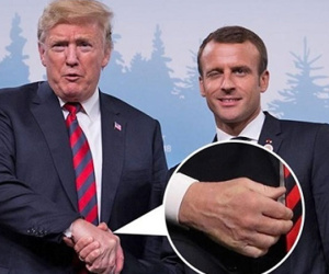 Tay Trump hằn vết sau cú bắt tay với Macron