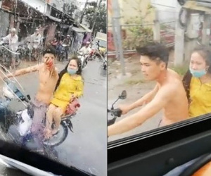 Video: Bị tạt nước ướt hết người, thanh niên đi xe máy 'nện' gạch vỡ kính lái ô tô