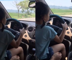 Bố cho con gái nhỏ cầm lái ô tô, mẹ quay phim khen 'lái xe siêu thế' khiến cư dân mạng bức xúc