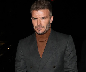 David Beckham bỗng cau mày khó chịu khi đi dự tiệc cùng Victoria và con trai cả Brooklyn