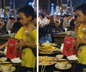 Rớt nước mắt hình ảnh cậu bé nhặt nhạnh chút đồ thừa trên bàn rồi ăn ngấu nghiến để lấp đầy chiếc bụng đói giữa phố Sài Gòn
