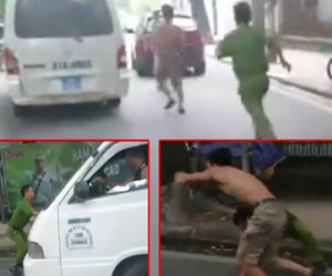 Phụ xe biển xanh “vật lộn” với cảnh sát để tài xế bỏ chạy