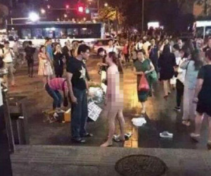 Lột đồ giữa phố vì bạn trai không tặng iPhone 6S