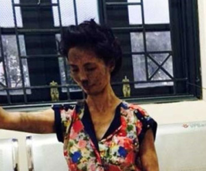 Ngáo đá, một phụ nữ tự đốt nhà rồi leo ra lan can gào thét