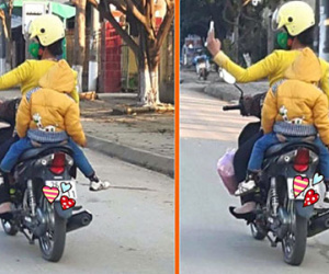 Đèo con bằng xe máy, mẹ tranh thủ chụp ảnh "tự sướng"